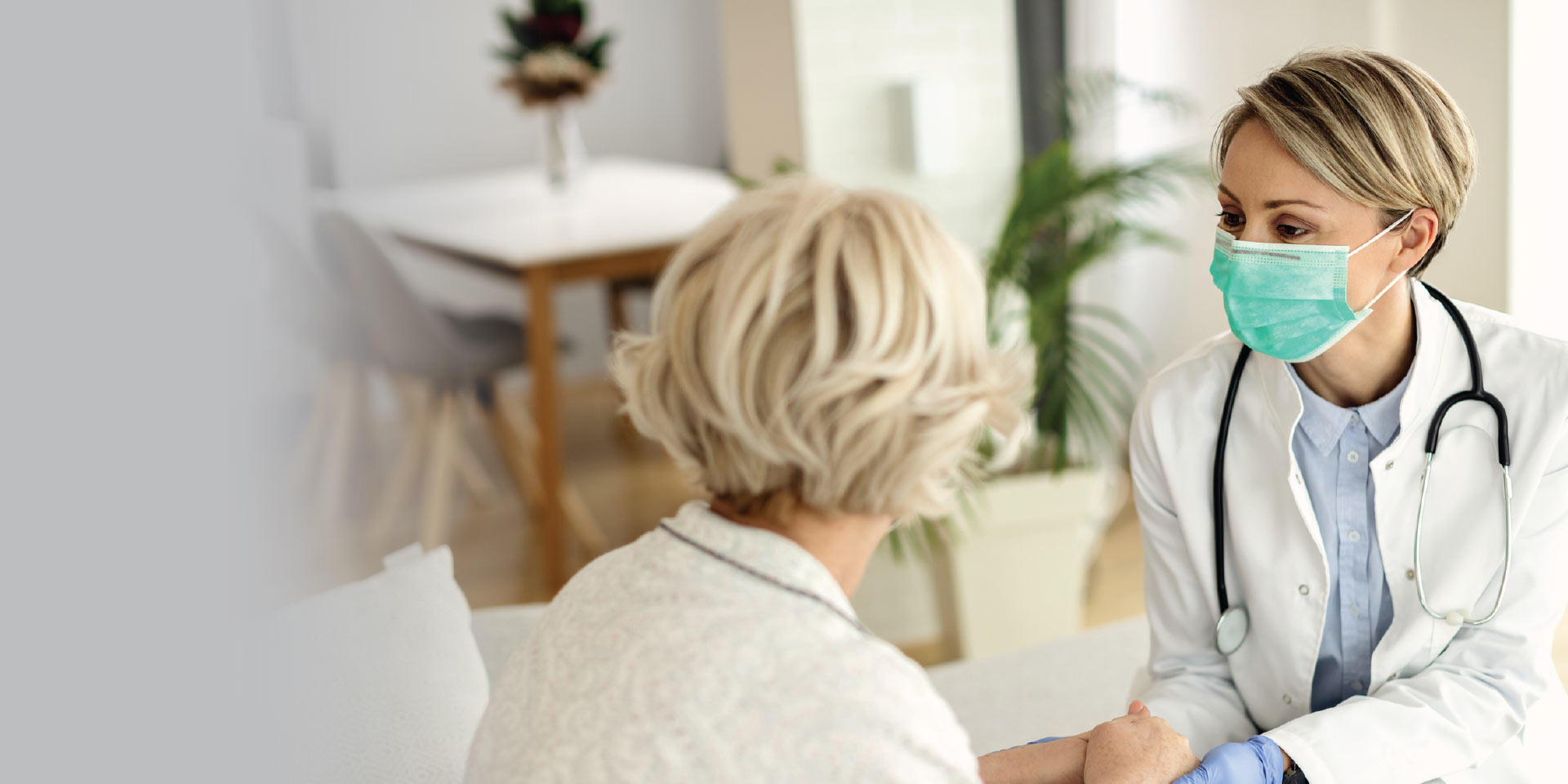 A physician giving her patient a checkup