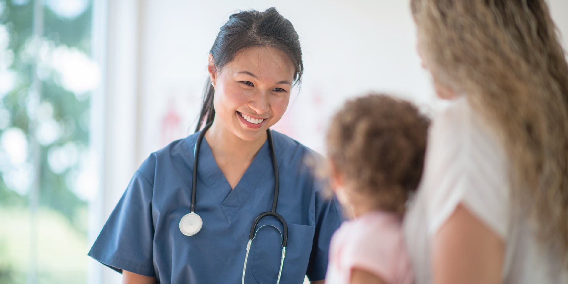 A physician meeting with her client