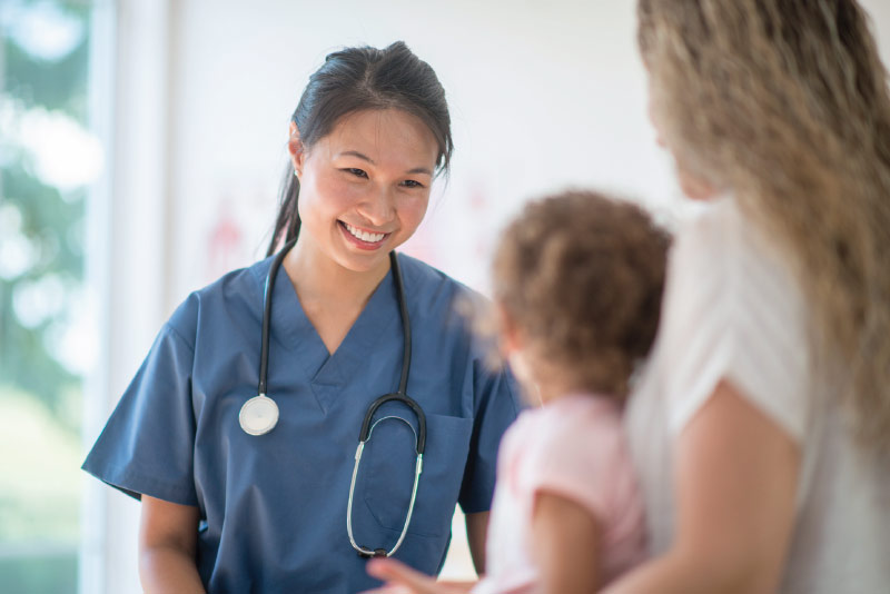 A physician meeting with her client