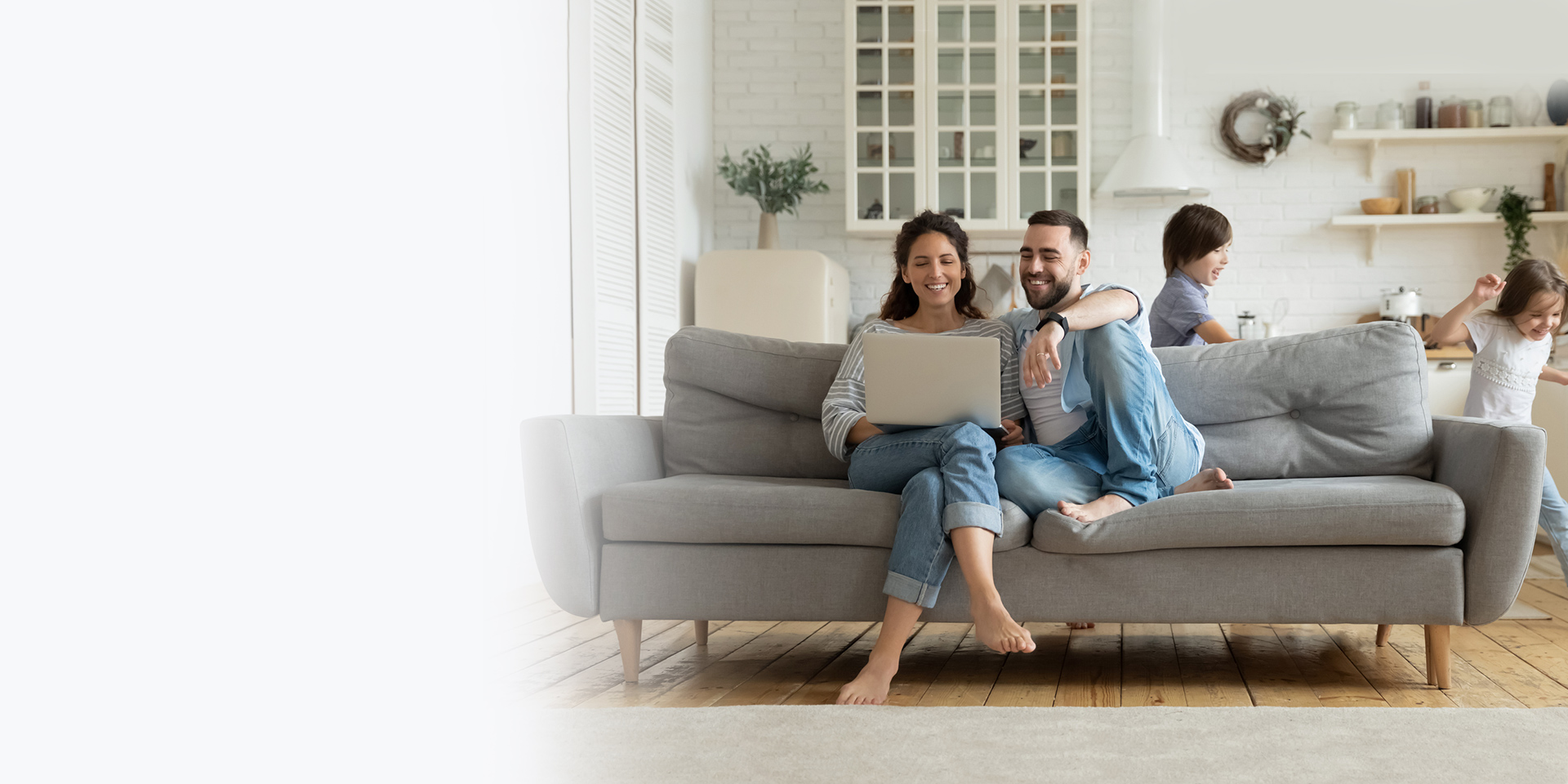 A husband and wife paying for their mortgage online