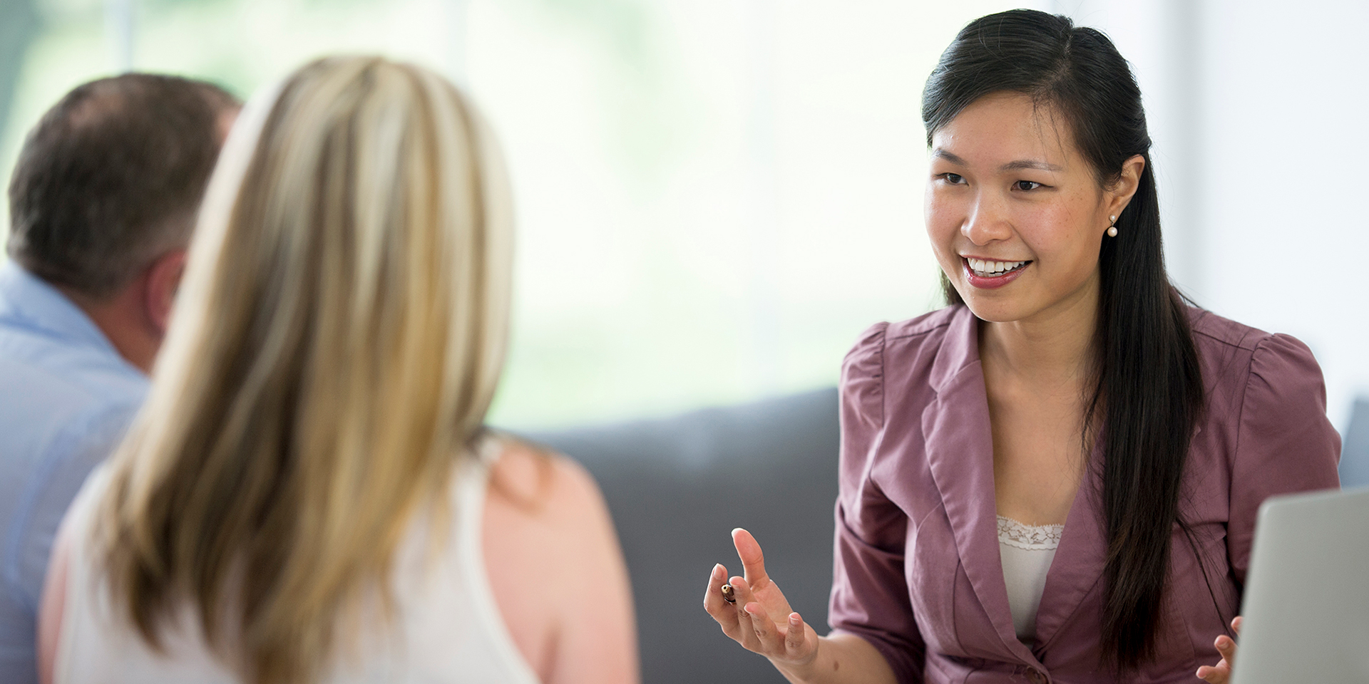 A banker meeting with her clients