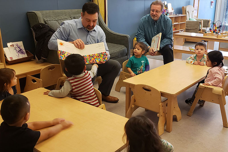 First Midwest colleagues volunteering and reading to children 
