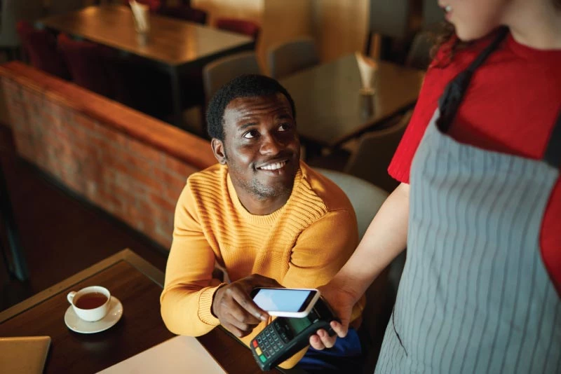 A man paying with a digital payment