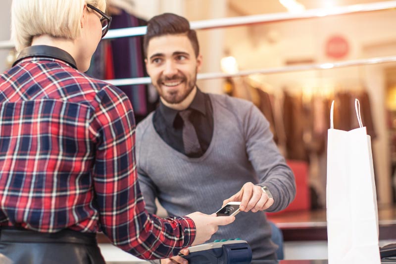 A shopper paying with Google Pay