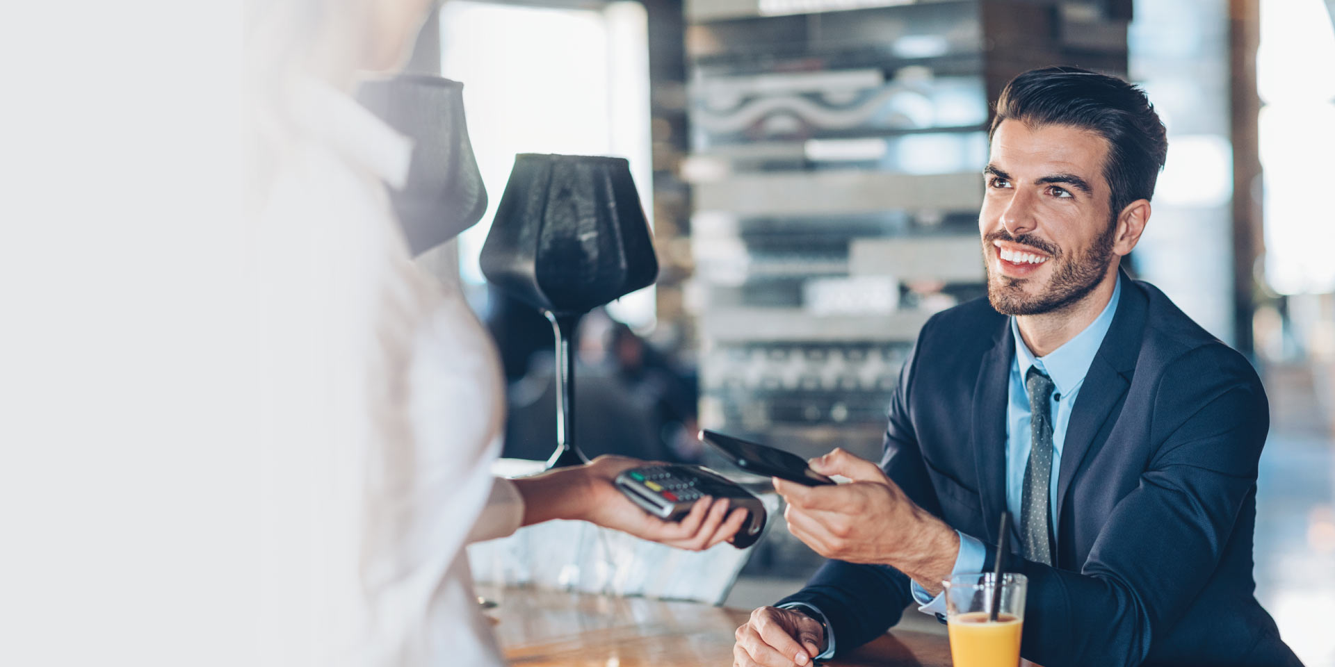 A gentleman paying through his digital wallet