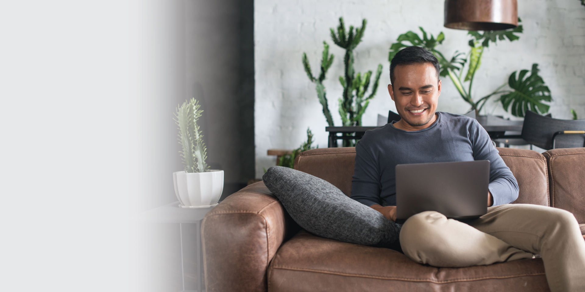 A man enrolling in eStatements from his laptop