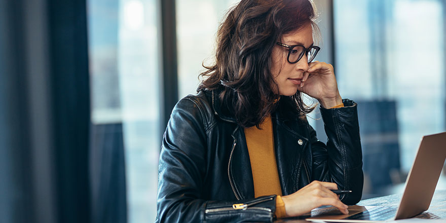 Woman looking at her laptop