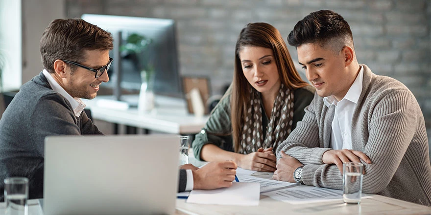 Financial advisor reviewing documents with his client