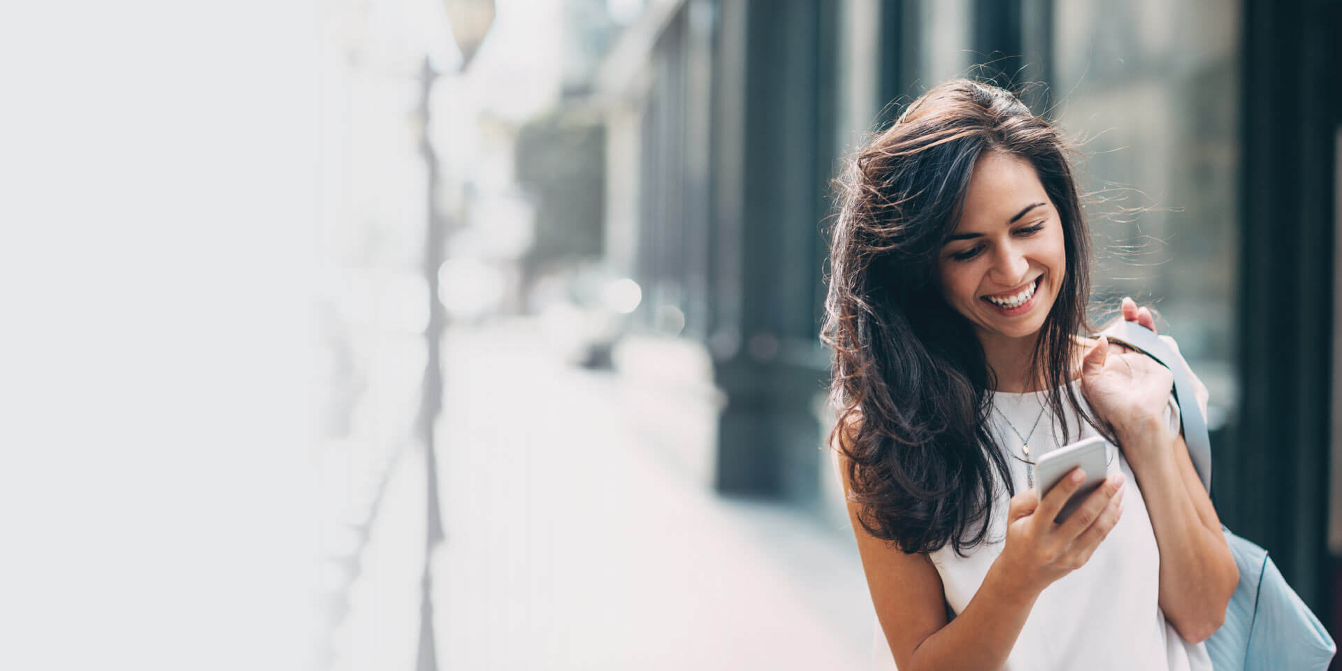 A woman with her mobile device in her hand