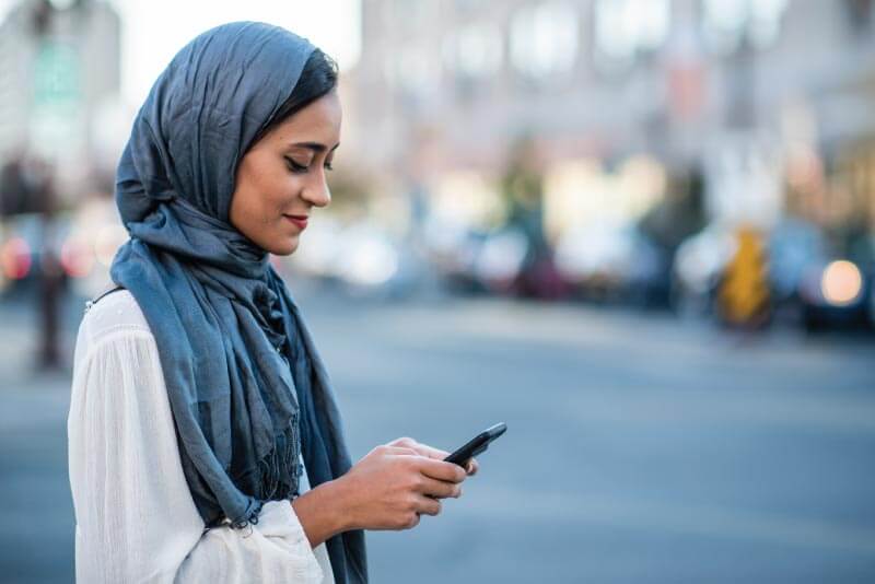 A women looking at her mobile device