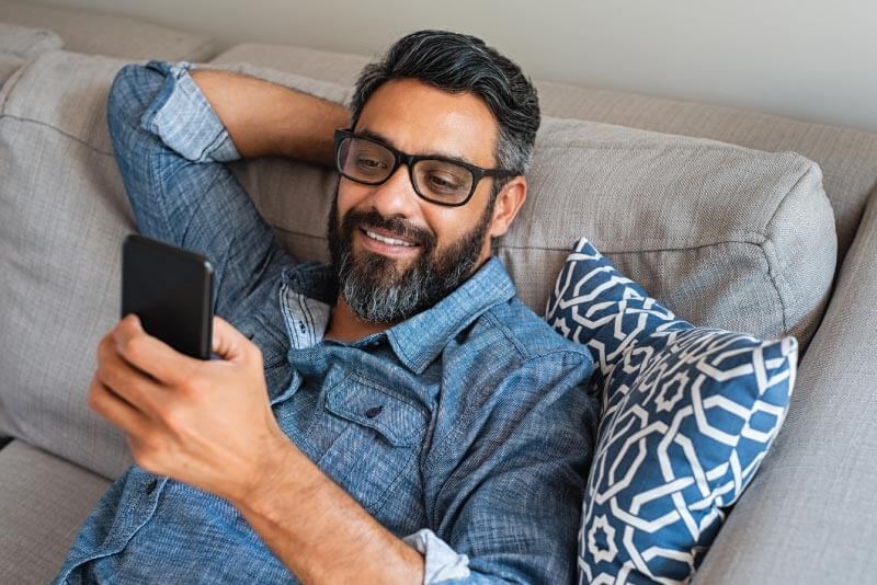 A gentleman managing his mobile settings