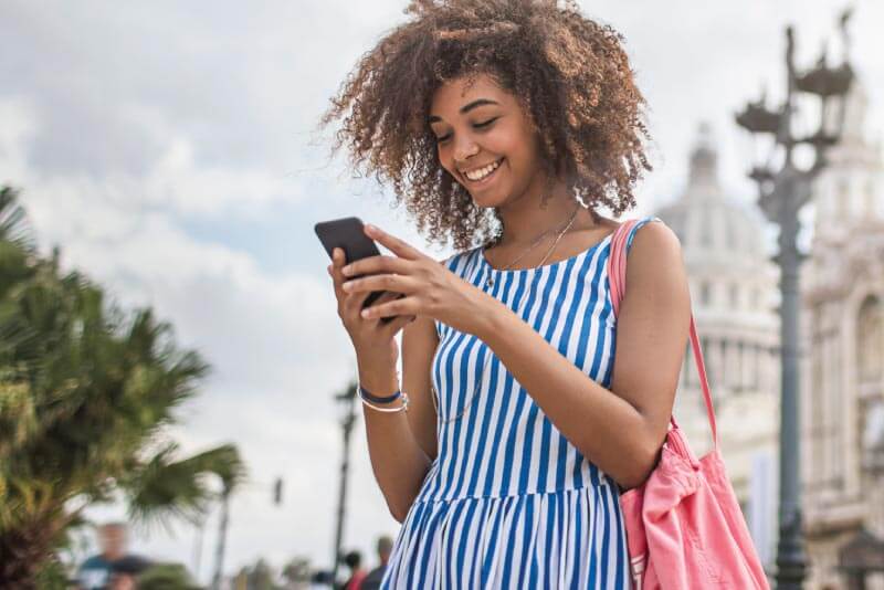 A woman looking at her mobile phone