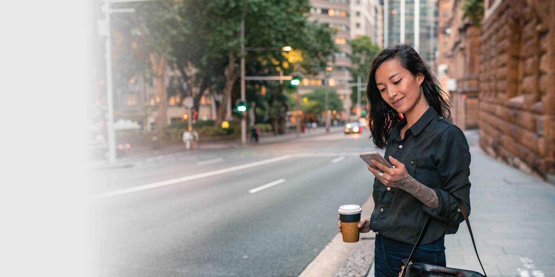 A woman with her mobile device in her hand